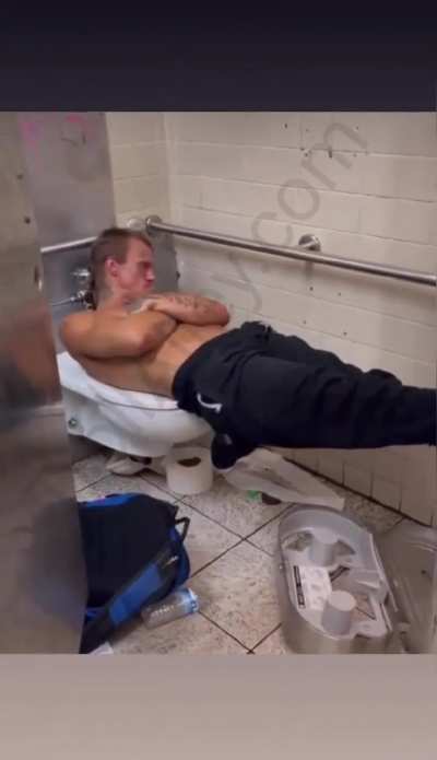 Laying on the toilet does not look comfortable 