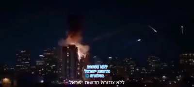 Mental footage from current iran attack on israel of a missile hitting a residential house