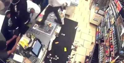 Large crowd of people looting a 7/eleven in Los Angeles California