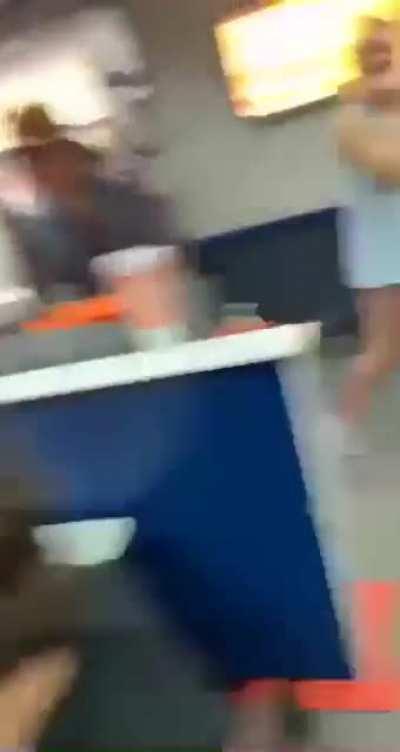 Guy holds door open while person in truck starts 