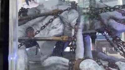 On the streets of Tokyo, they noticed a transport with a monster in a transparent cage. As it turned out, this is an advertisement for the film 