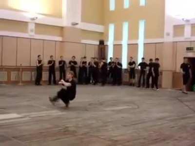 Russian guy squat kick dancing insanely fast