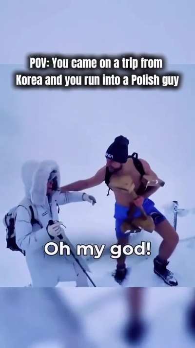 Polish man walks up a snowy mountain without excessive clothing.