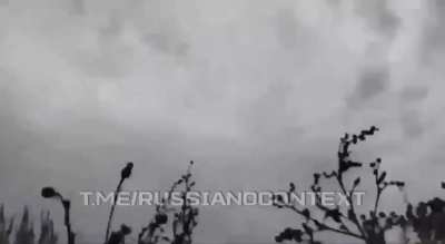 Russian soldiers watching their armored vehicle getting obliterated almost gets hit by its cope cage
