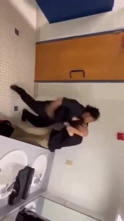 Bathroom fight over piece of paper.