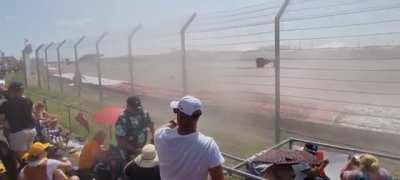 Another look at Max's crash, with debris raining over spectators
