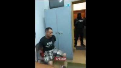 TV falls on angry man at police station
