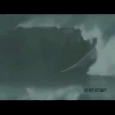 Dude Surfing in Tsunami