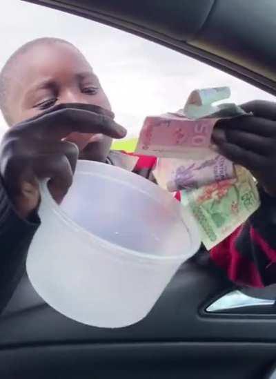 Men support little boy’s business selling guavas