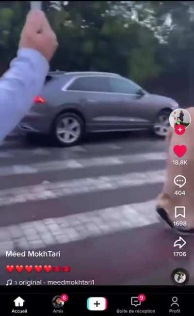 Old Moroccan man celebrates his country's football victory with his fellow citizens