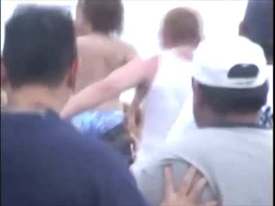 Topless wrestling on the beach 