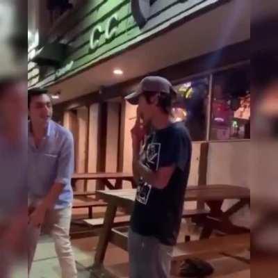 Guy gets hit for saying the N word