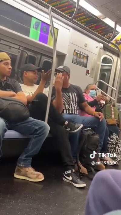 Vicious elbows delivered during a subway fight over one man falling asleep on another man's shoulder.