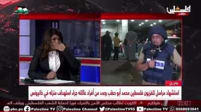 Journalist in Gaza removes his protective uniform after the killing of colleague Mohammed Abu Hatab: