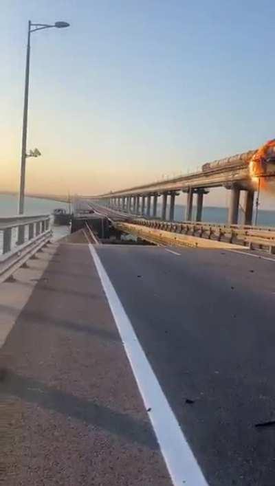 MEGA BREAKING The collapsed road span of the Kerch Bridge after an apparent missile attack