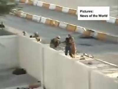Civilians in Iraq harass and attack the invading UK soldiers, who respond by gathering small boys and beating them while filming and cheering.
