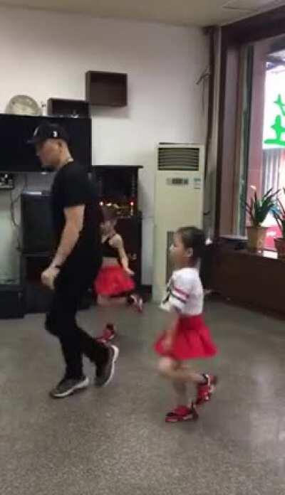 Like father like daughters, dancing like pros.