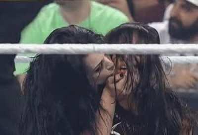 Paige kissing a unconscious and defeating AJ Lee