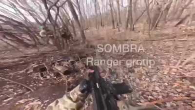Brazilian volunteer soldier and his Ukrainian brothers-in-arms encounter a Russian soldier in a forest in the Luhansk. The Russian suddenly reaches for his rifle.