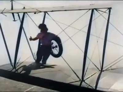 An extremely brave woman jumps from plane to plane to mid-air to change a landing gear. 1926.