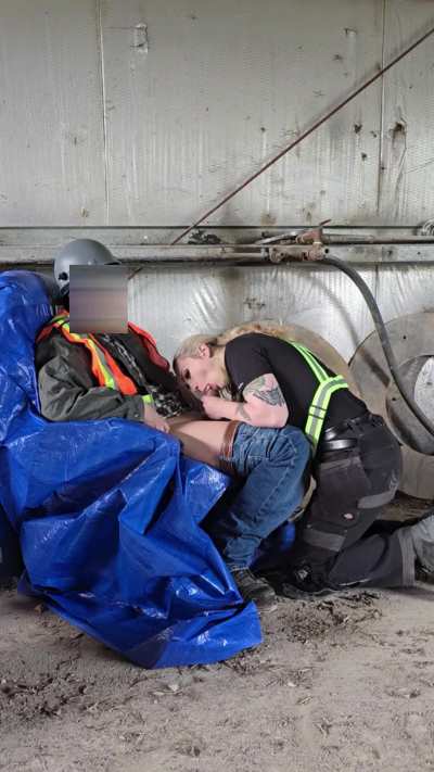 Asian plumber gets some help servicing his pipe