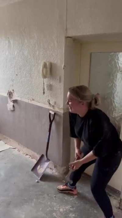 Take that hammer away before she hurts herself or you, and show her how to use it properly.