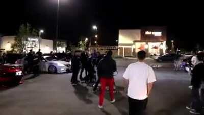 An altercation breaks out at a car meet in Los Angeles
