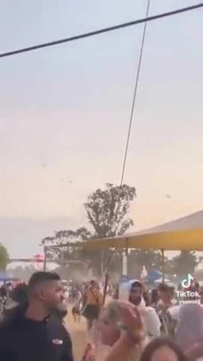 Video of people dancing at a festival near Gaza as Hamas paragliders can be seen landing in the distance. At least one woman from the festival has been confirmed killed.