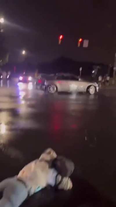 Woman tries to physically stop a street
