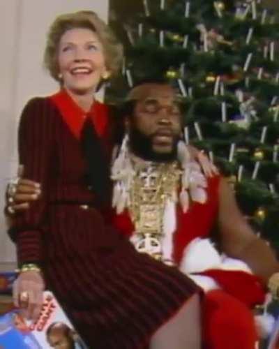 Nancy Reagan sitting on Mr. T's lap 🎅 1983