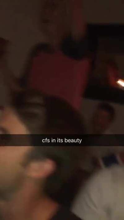 The boys gathered for a football game when a commercial for a nice knife comes on.