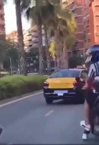 That is a child on the back of the bike. Barcelona, today.