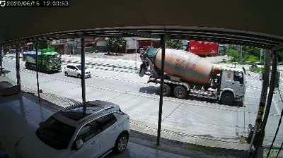 (NSFW) Car being sandwiched between two trucks.
