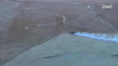 Hayat Tahrir al-Sham (HTS) crush two fleeing IS fighters with a tank. Eastern Hama in late 2017