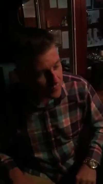 Two guys discussing music