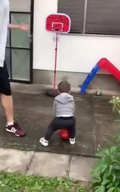 18 month old scores his first basket with his family as his teammates