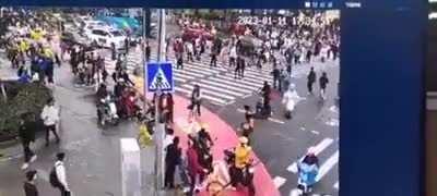 Security cam footage of driver running over pedestrians at busy intersection today in Guangzhou, China. 5 killed, 13 injured.