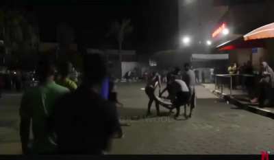 Paramedics abandon Palestinian man after dropping him on the floor outside of hospital in Gaza