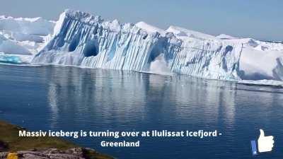 Huge iceberg overturns