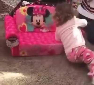 This little girl is so excited about her Minnie chair