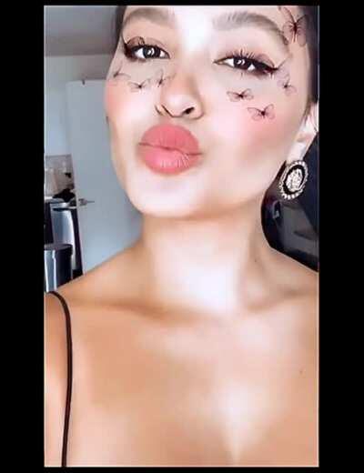Boobs, a kiss, and a wink