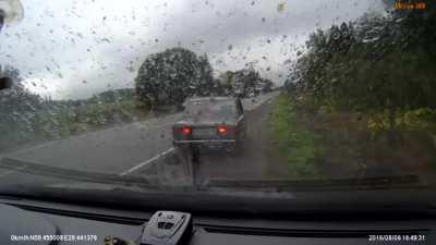 Four people (from what I can see) getting flung from their car