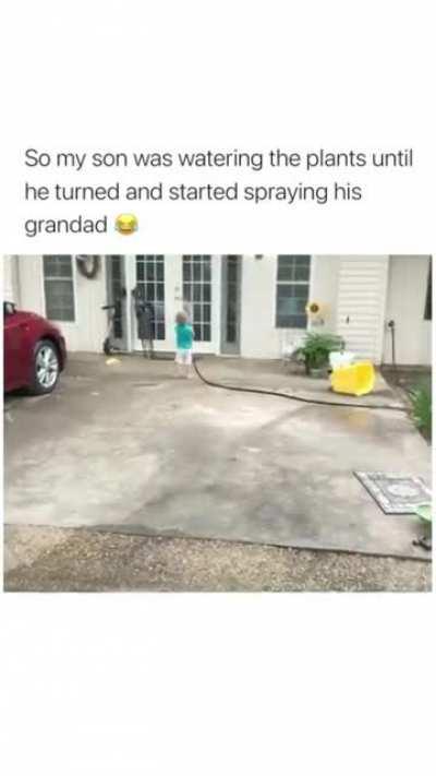Kid sprays his grandpa