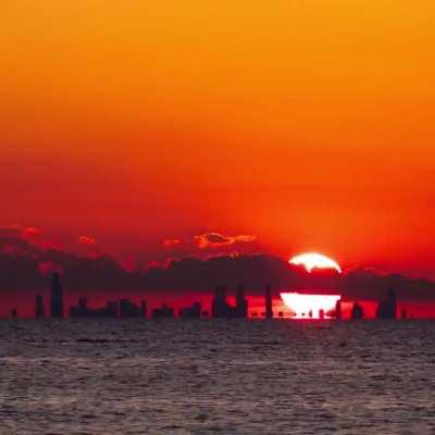 Watch the sun set behind the Chicago skyline from Porter Beach 33 miles across the lake!