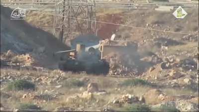 Mujahideen Army fighters target and destroy an Pro-Assad Iran-backed militia tank with a TOW missile, Aleppo countryside, Syria.