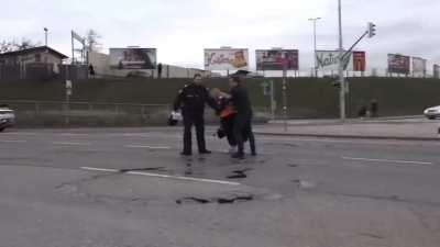 Activist slips on oil she spilled on the road