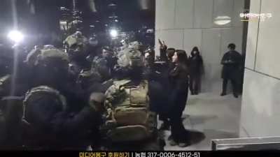 Soldier Hugs Protestor During Failed Coup in South Korea