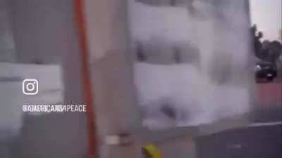 Cops lighting up a car with crowd control munitions in Compton CA