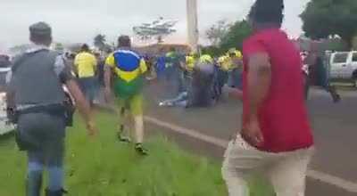 Car rams through pro-Bolsonaro protesters, unknown number of injuries.