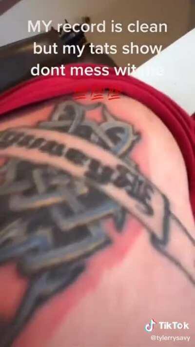 Clean record, sick tats